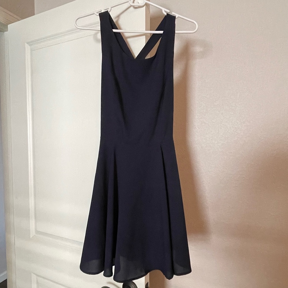 Size medium dress from Double Zero. Skater dress fit w/ accent bow on back.